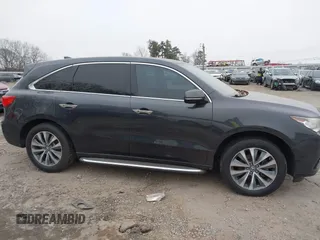 2016 Acura MDX w/Tech with VIN 5FRYD3H40GB018685, listed as a IAAI auction lot 41394033 with 148,990 mi miles. Bid and sale history available at carsss.com. Image 13.