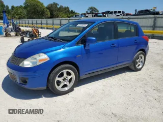 2009 Nissan Versa 1.8 S with VIN 3N1BC13E69L494607, listed as a Copart auction lot 52738515 with 164,102 mi miles and Salvage Title. Bid and sale history available at carsss.com. Image 1.
