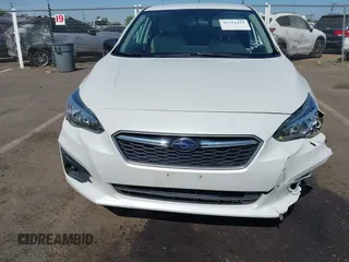 2018 Subaru Impreza with VIN 4S3GTAA64J3717886, listed as a IAAI auction lot 42572412 with 91,911 mi miles and . Bid and sale history available at DreamBid. Image 12.