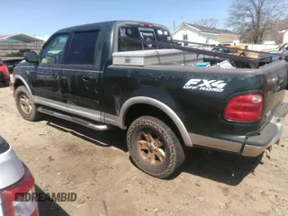 2002 Ford F-150 XLT with VIN 1FTRW08L12KC44008, listed as a IAAI auction lot 41811120 with 306,235 mi miles. Bid and sale history available at carsss.com. Image 3.
