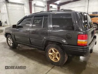 1998 Jeep Grand Cherokee Limited with VIN 1J4GZ88Z3WC165659, listed as a Copart auction lot 87527255 with 203,860 mi miles and Salvage Title. Bid and sale history available at carsss.com. Image 2.