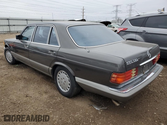 1987 Mercedes-Benz 560 with VIN WDBCA39D7HA322057, listed as a Copart auction lot 83717904 with 246,060 mi miles and Clean Title. Bid and sale history available at DreamBid. Image 2.