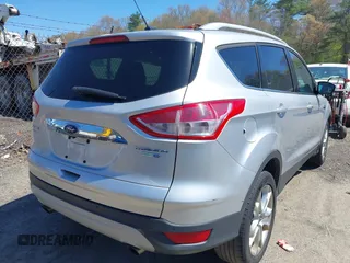 2016 Ford Escape Titanium with VIN 1FMCU9JXXGUA51537, listed as a IAAI auction lot 42118922 with 109,439 mi miles. Bid and sale history available at carsss.com. Image 4.