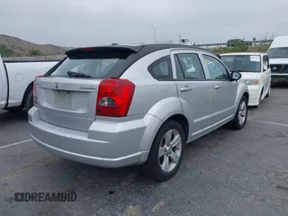 2010 Dodge Caliber SXT z VIN 1B3CB4HA9AD619378, wystawiony jako IAAI lot #42068680 z przebiegiem 182 668 mil mil oraz . Historia ofert i sprzedaży dostępna na DreamBid. Obrazek 4.