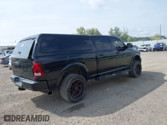 2015 Ram 2500 Laramie with VIN 3C6UR5FL0FG655552, listed as a IAAI auction lot 42456897 with 143,885 mi miles and . Bid and sale history available at DreamBid. Image 4.