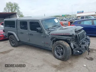 2021 Jeep Gladiator Rubicon with VIN 1C6JJTBG8ML619972, listed as a IAAI auction lot 42057805 with 37,875 mi miles and . Bid and sale history available at DreamBid. Image 14.