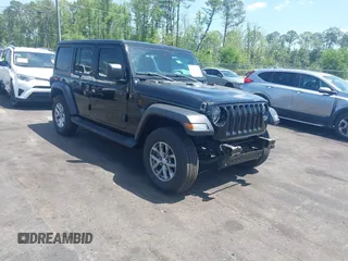2023 Jeep Wrangler Sport S with VIN 1C4HJXDN5PW671167, listed as a IAAI auction lot 42176127 with 1,230 mi miles and . Bid and sale history available at DreamBid. Image 1.