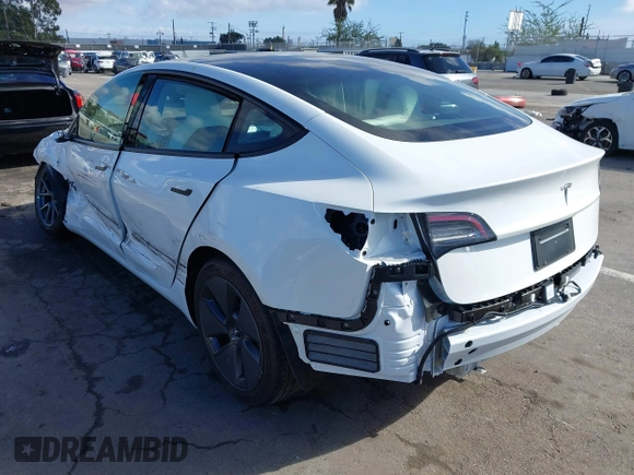 2023 Tesla Model 3 with VIN 5YJ3E1EA6PF495631, listed as a IAAI auction lot 41568118 with 10,073 mi miles and . Bid and sale history available at DreamBid. Image 3.
