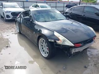 2013 Nissan 370Z with VIN JN1AZ4EH9DM880407, listed as a IAAI auction lot 42078526 with 216,029 mi miles. Bid and sale history available at carsss.com. Image 1.
