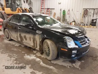 2010 Cadillac STS AWD with VIN 1G6DU6EV2A0125065, listed as a IAAI auction lot 41229886 with 84,954 mi miles and . Bid and sale history available at carsss.com. Image 1.