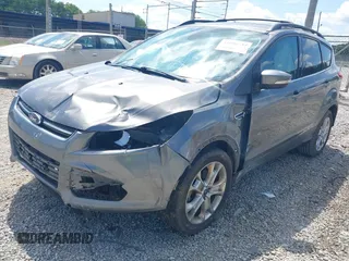 2013 Ford Escape SEL with VIN 1FMCU0HXXDUD51754, listed as a IAAI auction lot 42696434 with 145,705 mi miles and . Bid and sale history available at DreamBid. Image 2.
