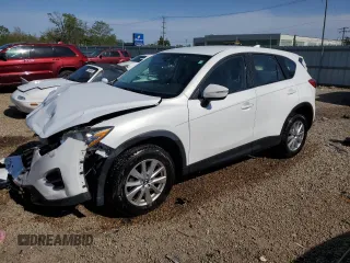 2016 Mazda CX-5 Sport z VIN JM3KE4BY1G0611368, wystawiony jako Copart lot #56979385 z przebiegiem 106 397 mil mil oraz Szkoda całkowita • Salvage title. Historia ofert i sprzedaży dostępna na DreamBid. Obrazek 1.