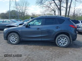 2016 Mazda CX-5 Touring with VIN JM3KE4CYXG0620990, listed as a IAAI auction lot 41978738 with 91,237 mi miles and . Bid and sale history available at carsss.com. Image 14.