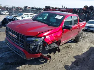 2024 GMC Canyon 4WD AT4X with VIN 1GTP6EEK1R1247720, listed as a IAAI auction lot 41571103 with 10,618 mi miles. Bid and sale history available at carsss.com. Image 2.