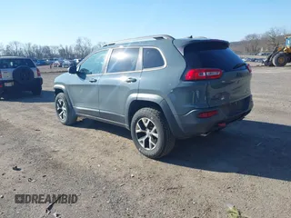 2014 Jeep Cherokee Trailhawk with VIN 1C4PJMBS4EW179763, listed as a IAAI auction lot 41988048 with 152,681 mi miles. Bid and sale history available at carsss.com. Image 3.