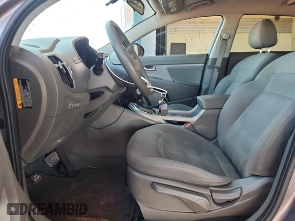 2011 Kia Sportage LX with VIN KNDPBCA22B7017760, listed as a Copart auction lot 60570025 with 118,617 mi miles and Salvage title. Bid and sale history available at DreamBid. Image 7.