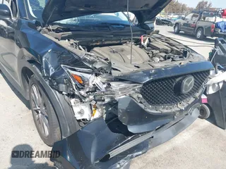 2019 Mazda CX-5 Grand Touring with VIN JM3KFADMXK1547727, listed as a IAAI auction lot 42138071 with Not provided miles and . Bid and sale history available at DreamBid. Image 6.