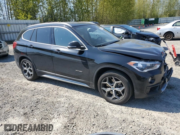 2017 BMW X1 xDrive28i with VIN WBXHT3C32H5F82141, listed as a Copart auction lot 53311785 with 52,867 mi miles and Salvage Title. Bid and sale history available at carsss.com. Image 4.