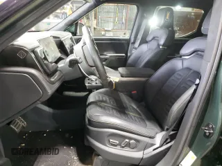 2023 Rivian R1T Adventure with VIN 7FCTGAAA0PN024165, listed as a Copart auction lot 84265444 with Not Provided miles and Salvage Title. Bid and sale history available at carsss.com. Image 7.