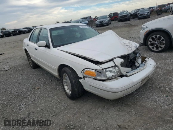 2000 Ford Crown Victoria LX z VIN 2FAFP74W4YX120352, wystawiony jako Copart lot #79833264 z przebiegiem Nie podano mil oraz Szkoda całkowita • Salvage title. Historia ofert i sprzedaży dostępna na DreamBid. Obrazek 4.