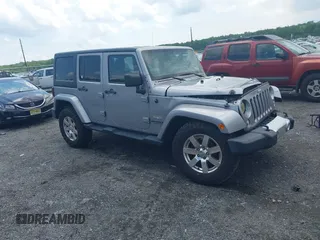 2014 Jeep Wrangler Unlimited Sahara z VIN 1C4BJWEG0EL129229, wystawiony jako IAAI lot #42380976 z przebiegiem 175 735 mil mil oraz . Historia ofert i sprzedaży dostępna na DreamBid. Obrazek 1.
