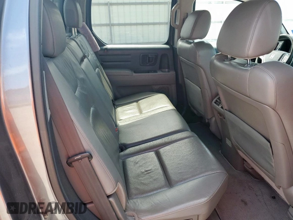 2014 Honda Ridgeline RTL z VIN 5FPYK1F53EB004694, wystawiony jako Copart lot #57222085 z przebiegiem 128 210 mil mil oraz Szkoda całkowita • Salvage title. Historia ofert i sprzedaży dostępna na DreamBid. Obrazek 10.