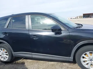 2014 Mazda CX-5 Touring with VIN JM3KE2CY9E0333951, listed as a IAAI auction lot 41825345 with 124,684 mi miles. Bid and sale history available at carsss.com. Image 13.
