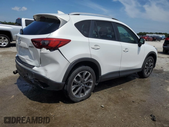 2016 Mazda CX-5 Grand Touring z VIN JM3KE2DYXG0731462, wystawiony jako Copart lot #58220465 z przebiegiem 130 033 mil mil oraz Szkoda całkowita • Salvage title. Historia ofert i sprzedaży dostępna na DreamBid. Obrazek 3.