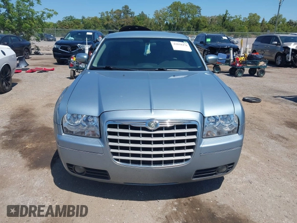 2006 Chrysler 300 Touring with VIN 2C3KA53G56H324954, listed as a IAAI auction lot 42058478 with 124,933 mi miles. Bid and sale history available at carsss.com. Image 12.