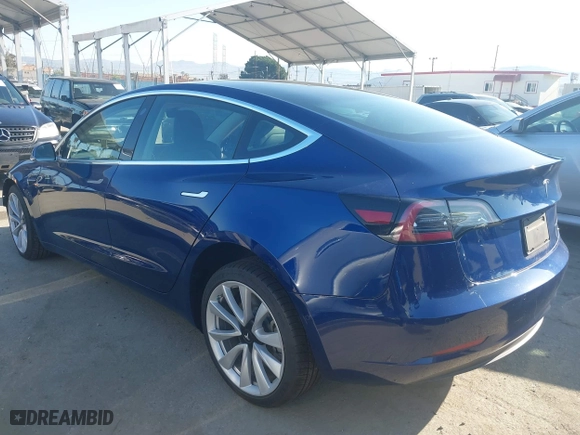 2019 Tesla Model 3 Long Range with VIN 5YJ3E1EB3KF497841, listed as a IAAI auction lot 41969728 with 21,127 mi miles. Bid and sale history available at carsss.com. Image 3.