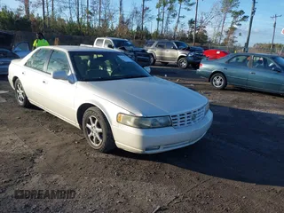 2003 Cadillac Seville Luxury SLS z VIN 1G6KS54Y33U164861, wystawiony jako IAAI lot #41131384 z przebiegiem 151 348 mil mil oraz . Historia ofert i sprzedaży dostępna na DreamBid. Obrazek 1.