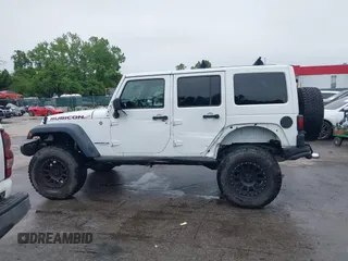 2014 Jeep Wrangler Unlimited Rubicon with VIN 1C4HJWFG4EL104827, listed as a IAAI auction lot 42236622 with 90,935 mi miles and . Bid and sale history available at DreamBid. Image 15.