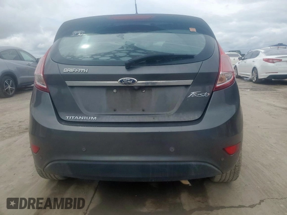 2015 Ford Fiesta Titanium z VIN 3FADP4FJ5FM203174, wystawiony jako Copart lot #60727515 z przebiegiem 91 898 mil mil oraz Czysty tytuł • Clean title. Historia ofert i sprzedaży dostępna na DreamBid. Obrazek 6.