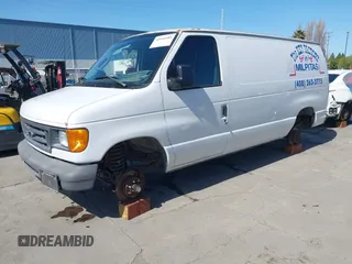 2003 Ford Econoline Cargo with VIN 1FTNE24L23HB81499, listed as a IAAI auction lot 41944485 with 86,629 mi miles and . Bid and sale history available at DreamBid. Image 2.