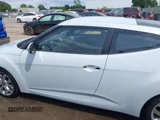 2015 Hyundai Veloster z VIN KMHTC6AD8FU222744, wystawiony jako IAAI lot #42129397 z przebiegiem Nie podano mil oraz . Historia ofert i sprzedaży dostępna na DreamBid. Obrazek 13.