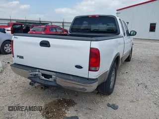 2003 Ford F-150 XL with VIN 1FTRX17L33NB79733, listed as a IAAI auction lot 42023385 with 136,236 mi miles. Bid and sale history available at carsss.com. Image 4.