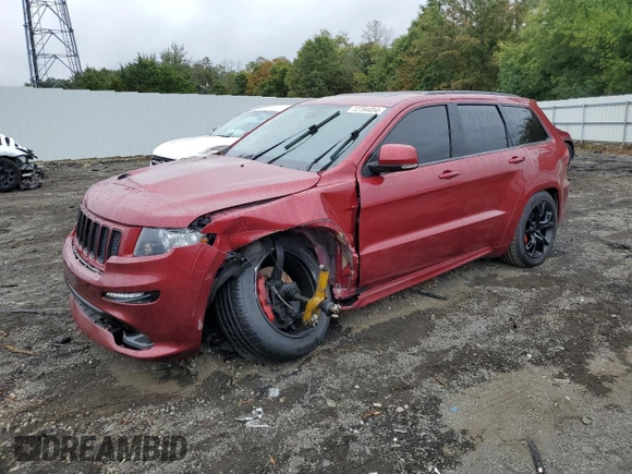 2012 Jeep Grand Cherokee SRT8 with VIN 1C4RJFDJ0CC351195, listed as a Copart auction lot 72794454 with 104,672 mi miles and Salvage Title. Bid and sale history available at carsss.com. Image 1.