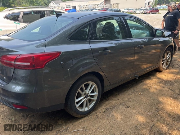 2017 Ford Focus SE with VIN 1FADP3F23HL200927, listed as a Copart auction lot 60996055 with Not provided miles and Clean title. Bid and sale history available at DreamBid. Image 4.