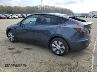2023 Tesla Model Y Long Range with VIN 7SAYGDEE2PA024693, listed as a Copart auction lot 52595935 with 35,179 mi miles and Salvage Title. Bid and sale history available at DreamBid. Image 2.