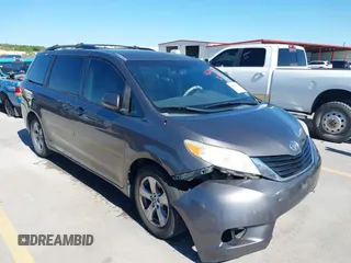 2014 Toyota Sienna LE AAS with VIN 5TDKK3DC8ES457023, listed as a IAAI auction lot 42067713 with 335,130 mi miles. Bid and sale history available at carsss.com. Image 1.