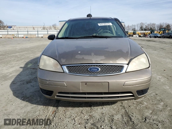 2005 Ford Focus S with VIN 1FAFP34N35W141023, listed as a Copart auction lot 84230574 with 244,545 mi miles and Salvage Title. Bid and sale history available at carsss.com. Image 5.