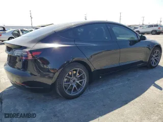 2021 Tesla Model 3 Standard Range Plus with VIN 5YJ3E1EAXMF069467, listed as a Copart auction lot 63273134 with 66,393 mi miles and Salvage Title. Bid and sale history available at carsss.com. Image 3.