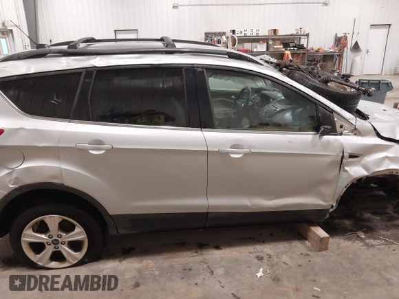 2013 Ford Escape SE with VIN 1FMCU9GX7DUB89197, listed as a IAAI auction lot 42311546 with 131,263 mi miles and . Bid and sale history available at DreamBid. Image 14.