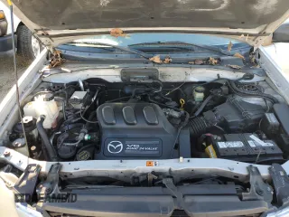 2001 Mazda Tribute LX with VIN 4F2CU08111KM20113, listed as a Copart auction lot 87681195 with 144,400 mi miles and Salvage Title. Bid and sale history available at DreamBid. Image 12.