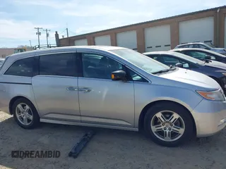 2012 Honda Odyssey Touring with VIN 5FNRL5H92CB108690, listed as a IAAI auction lot 41826580 with 150,327 mi miles and . Bid and sale history available at DreamBid. Image 13.