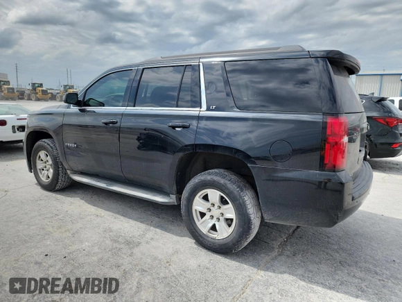 2015 Chevrolet Tahoe LT with VIN 1GNSKBKC0FR226220, listed as a Copart auction lot 59214125 with 260,330 mi miles and Salvage title. Bid and sale history available at DreamBid. Image 2.