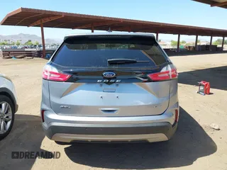 2021 Ford Edge SEL z VIN 2FMPK4J98MBA50772, wystawiony jako IAAI lot #42224052 z przebiegiem 76 061 mil mil oraz . Historia ofert i sprzedaży dostępna na DreamBid. Obrazek 16.