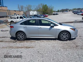 2021 Toyota Corolla Hybrid LE with VIN JTDEAMDE5MJ022110, listed as a IAAI auction lot 41912920 with 59,198 mi miles. Bid and sale history available at carsss.com. Image 13.