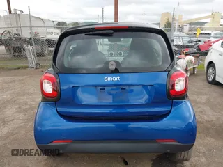 2016 Smart fortwo Passion z VIN WMEFJ5DA8GK059871, wystawiony jako IAAI lot #41624917 z przebiegiem 90 906 mil mil oraz . Historia ofert i sprzedaży dostępna na DreamBid. Obrazek 16.