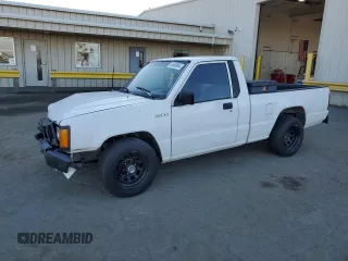 1990 Mitsubishi Mighty Max with VIN JA7FL24W2LP028418, listed as a Copart auction lot 83680804 with 331,687 mi miles and Salvage Title. Bid and sale history available at DreamBid. Image 1.